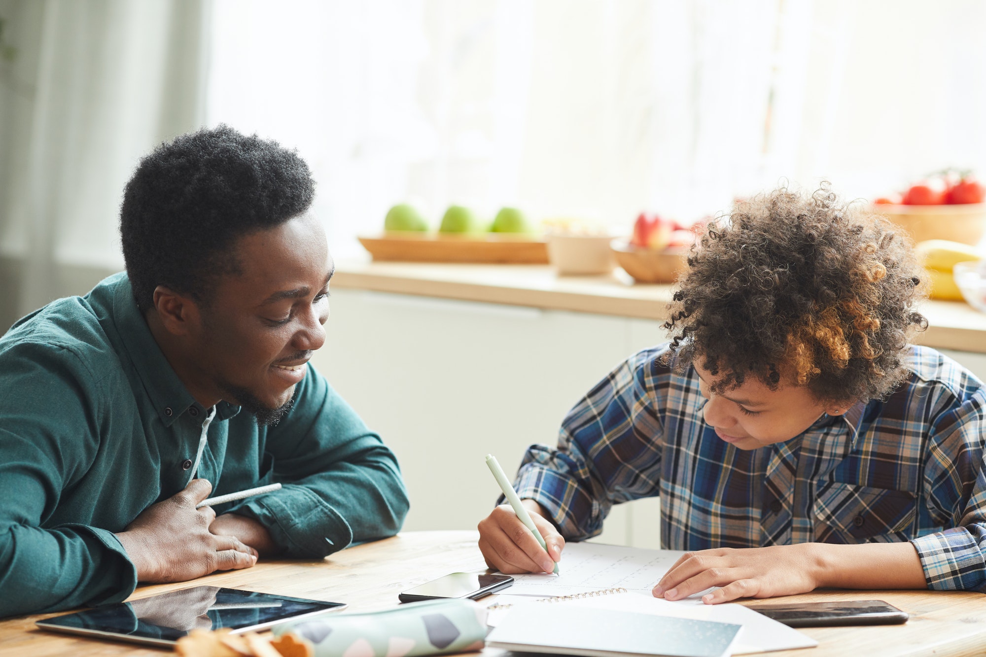 Father and son studying at home